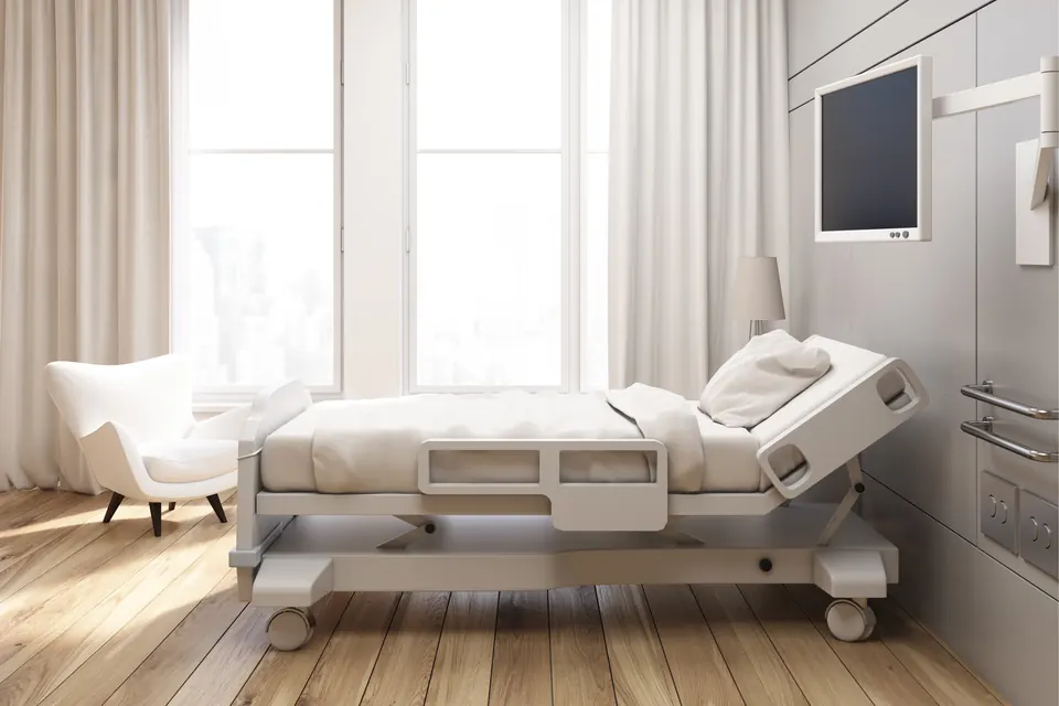 Hospital patient room with bed